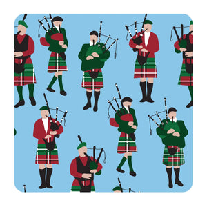 Bagpipes coaster featuring an illustration of Scottish bagpipers in traditional kilts on a blue background, perfect for protecting surfaces and gifting.