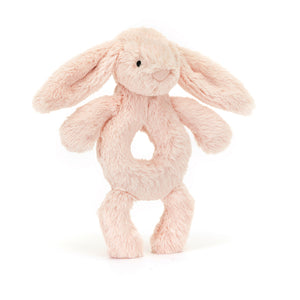 The Jellycat Bashful Blush Bunny Ring Rattle features soft fur, floppy ears and a hidden rattle, perfect for cuddles and playtime.