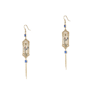 Pair of gold-plated bird cage drop earrings with delicate blue crystals and enamel bird detailing, shown on white background for product display.