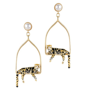 Gold-plated triangle hoop earrings with hand-painted clouded leopards and pearl stud posts, designed by Bill Skinner.