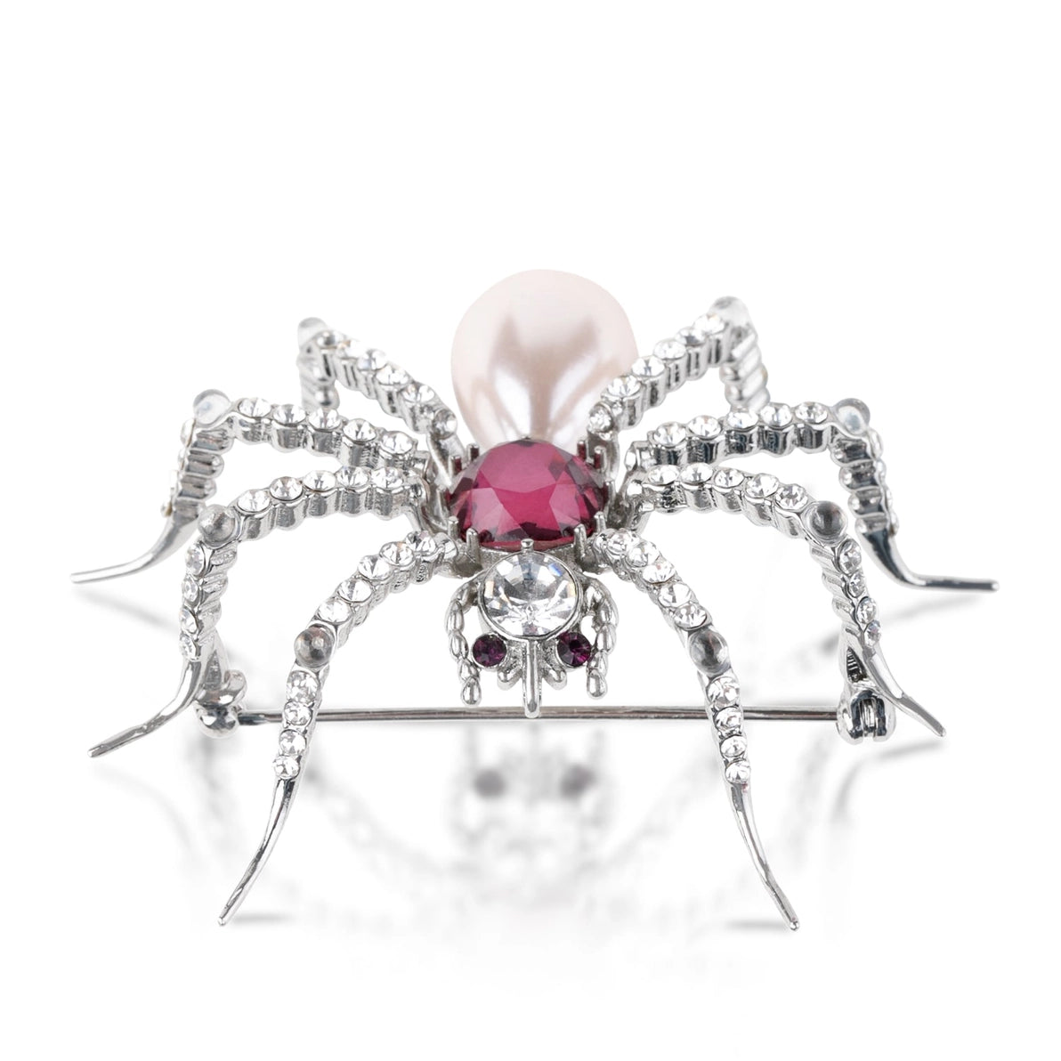 Side profile of Pearl Spider Brooch by Bill Skinner showing dimensional silver legs set with sparkling crystals, a faceted amethyst gemstone, and a large pearl drop accent.