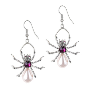 Front view of Bill Skinner Pearl Spider Drop Earrings featuring rhodium-plated brass, sparkling amethyst crystals, and teardrop-shaped resin pearl bodies against a white background.