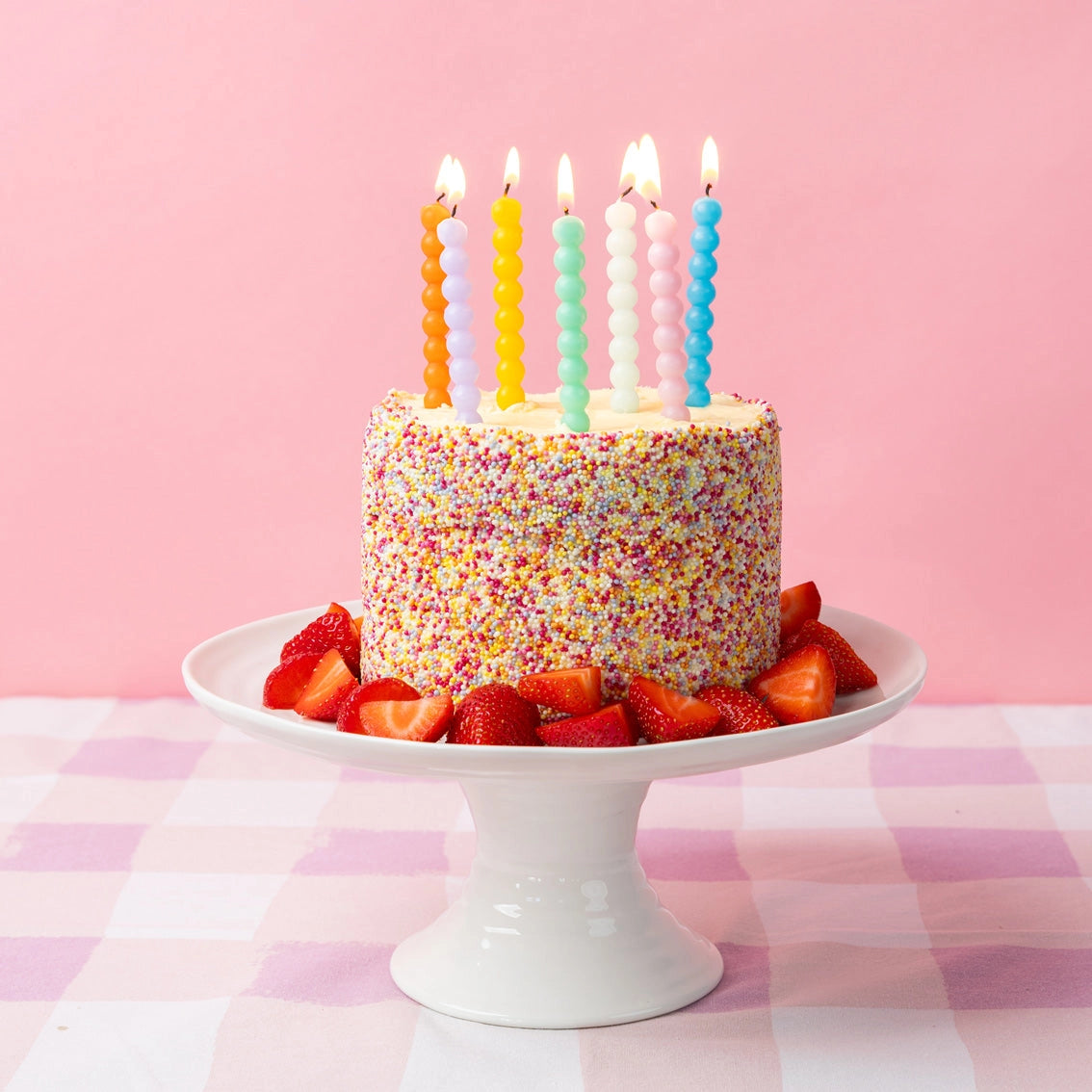 Birthday cake topped with multicolour bobble candles – Birthday Brights Candle Set by Talking Tables.