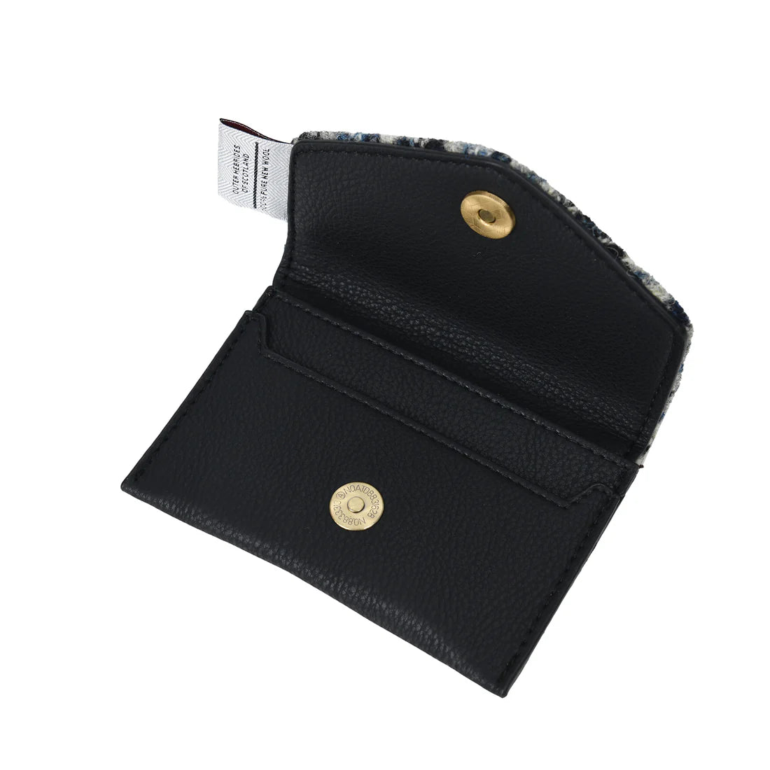 Inside the black herringbone harris tweed card holder. 