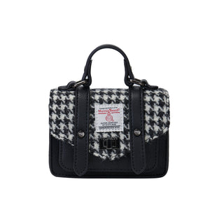 Islander Harris Tweed Wee Satchel with a Black and White Dogtooth design and a black PU leather Body.
