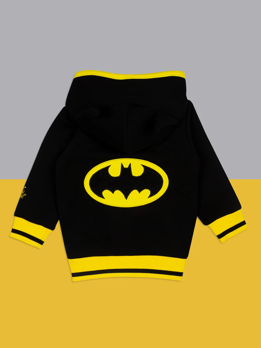 Flat lay back view of Batman “Get Ready” Hoodie with large yellow bat logo and bold yellow hem and cuffs.
