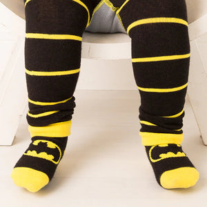 Toddler wearing Blade & Rose Batman Get Ready Socks with matching black and yellow striped leggings.