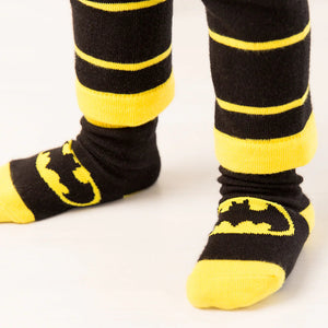 Close-up side view of toddler’s feet in Blade & Rose Batman Get Ready Socks showing Batman logo and yellow accents.