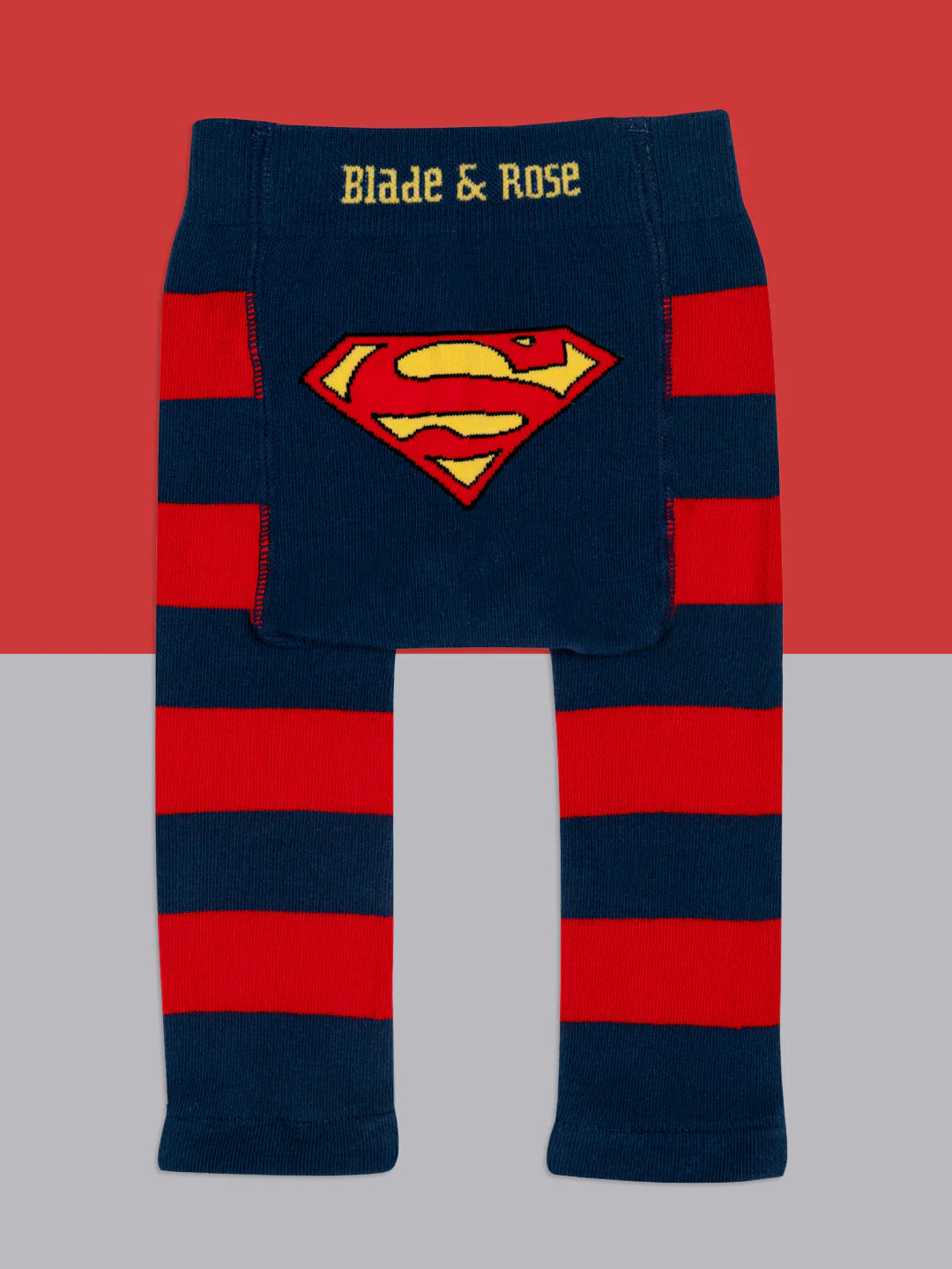 Flat lay of Blade & Rose Superman™ Saves the Day leggings, navy and red striped design with bold Superman™ shield on the back panel.