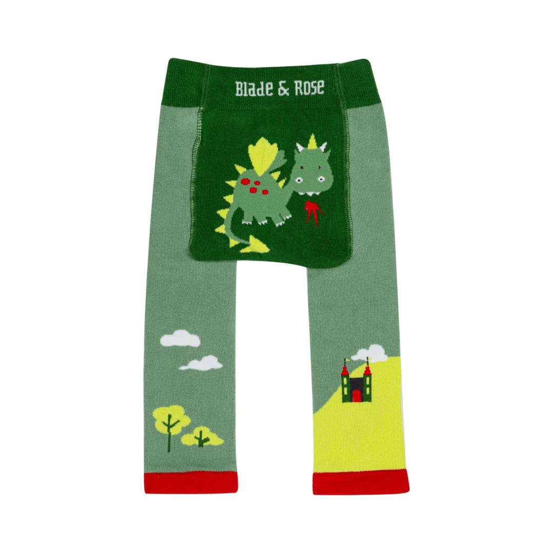 Green baby leggings with fire-breathing dragon and landscape print by Blade & Rose, shown flat.