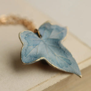 Handmade Blue Ivy Leaf Necklace with duck egg blue enamel, featuring intricate veining and a nature-inspired brass pendant on an 18-inch chain.