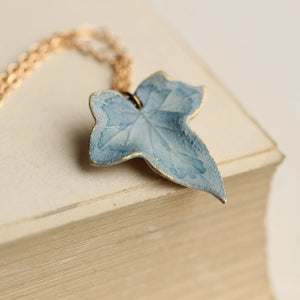 Close-up of Blue Ivy Leaf Pendant with delicate hand-painted enamel, crafted in Edinburgh with a watercolour-style finish.