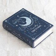 Blue Moon Book Shaped Storage Box with celestial moon and stars design on cover.