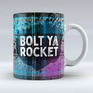 Bolt Ya Rocket Scottish tartan ceramic mug with bold text.