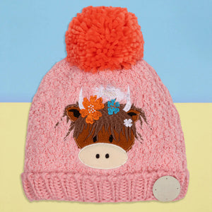Bonnie Highland Cow Winter Hat – pink knit hat with embroidered Highland cow face and orange pom pom.