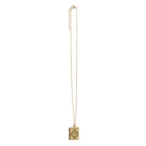 Full view of long gold necklace with closed book-shaped locket pendant.