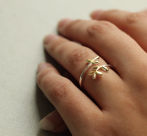 Botanical Sprig Ring displayed on a hand, highlighting its adjustable fit and natural design.