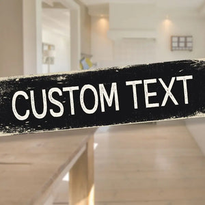 A personalised custom metal sign with “CUSTOM TEXT” in bold, vintage-style typography on a distressed black background, perfect for home or office décor.