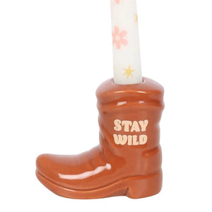 Close-up of “Stay Wild” text on the ceramic cowboy boot candle holder.