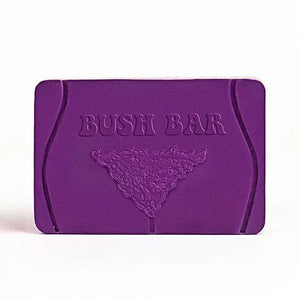 Purple Bush Bar Soap with cheeky embossed body hair design and coconut scent, novelty body positive bath accessory.