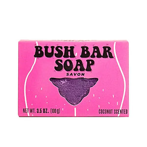 Bush Bar Soap pink packaging with bold lettering and cut-out window revealing purple coconut-scented soap inside.