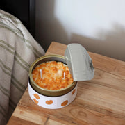 Caramel Popcorn candle styled on wooden bedside table with opened tin lid, adding a cosy, whimsical touch to home décor.