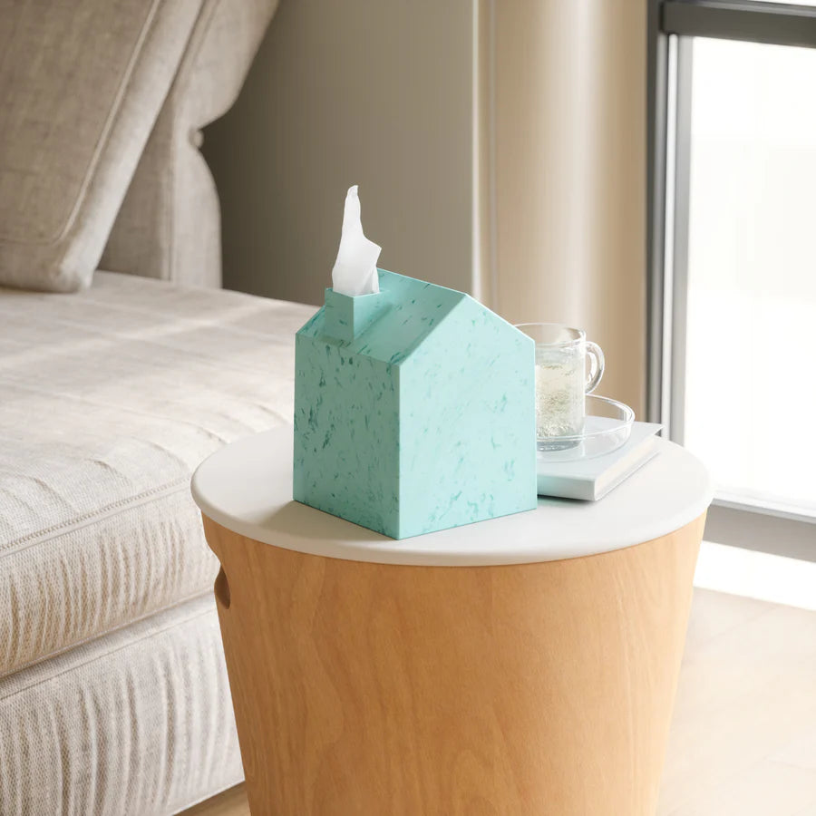 Umbra Casa Ocean tissue cover ocean blue on bedside table with books