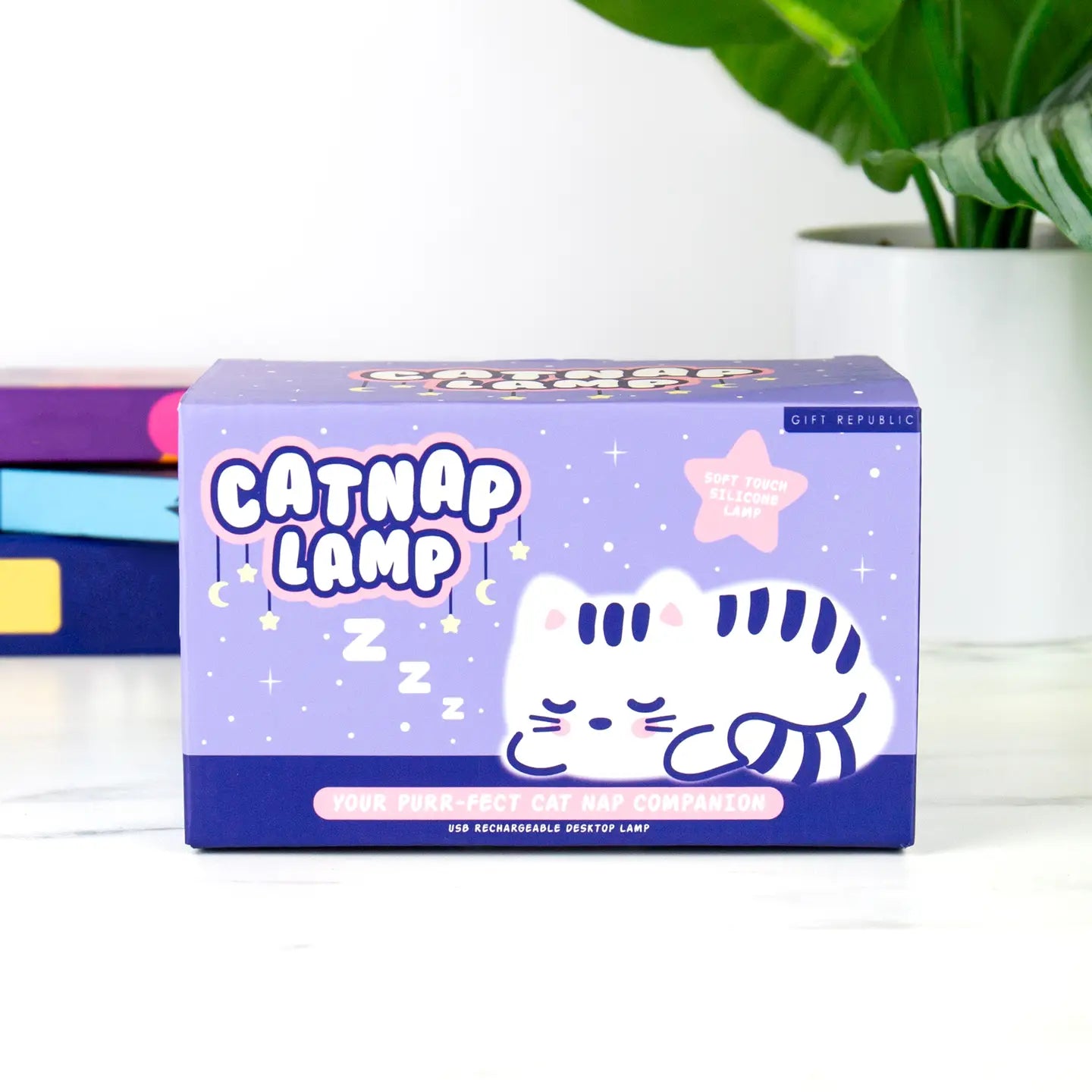 Catnap Lamp packaging featuring a cute sleeping cat design on a purple box.