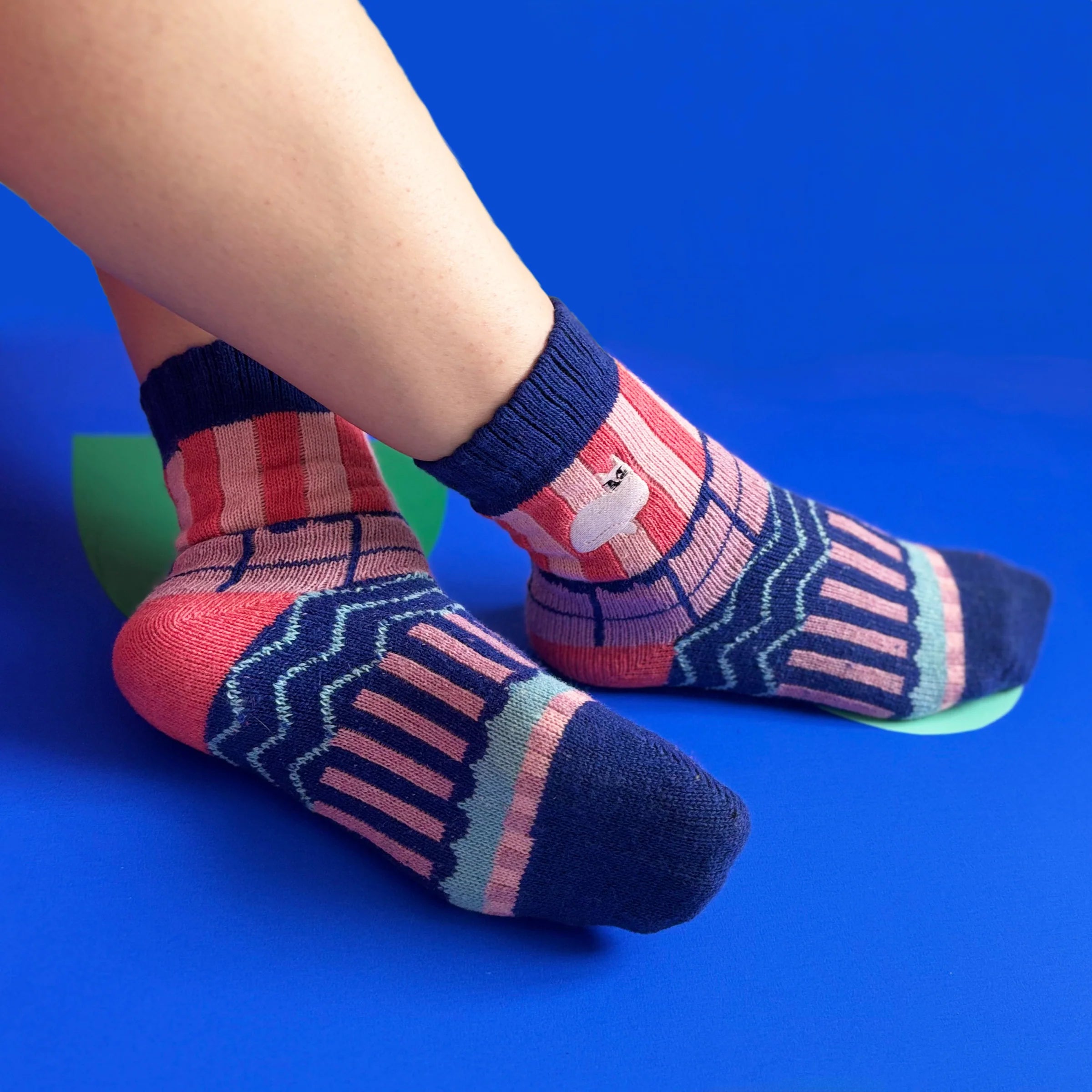 Model wearing Catnip Fair Isle Socks with pink, navy, and mint patterns and embroidered cat design.