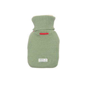 Back view of green knitted hot water bottle cover with House of Disaster label.