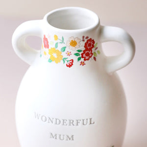 Close-up of floral detailing on the Ceramic Wonderful Mum Vase, showing pink, red, yellow, and green flowers.