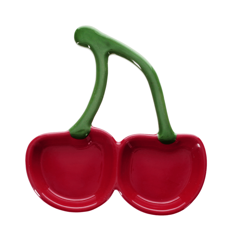 Red cherry ceramic dish angled view on white background