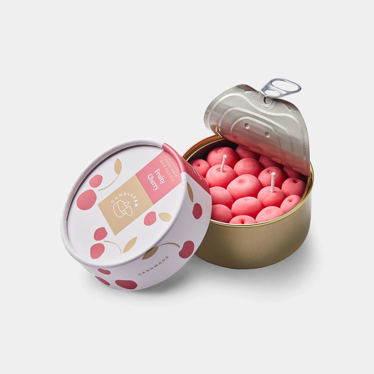 Open cherry-scented candle tin showing realistic cherry-shaped wax candles with pull-tab lid and illustrated packaging.