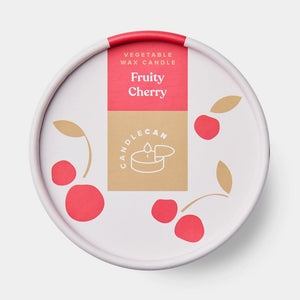 Close-up of Fruity Cherry CandleCan lid featuring cherry illustrations and product name in bold pink and gold label.