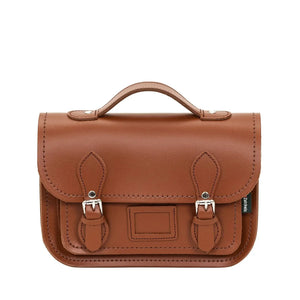 Satchel in dark brown leather with a top handle and with two buckle closers.