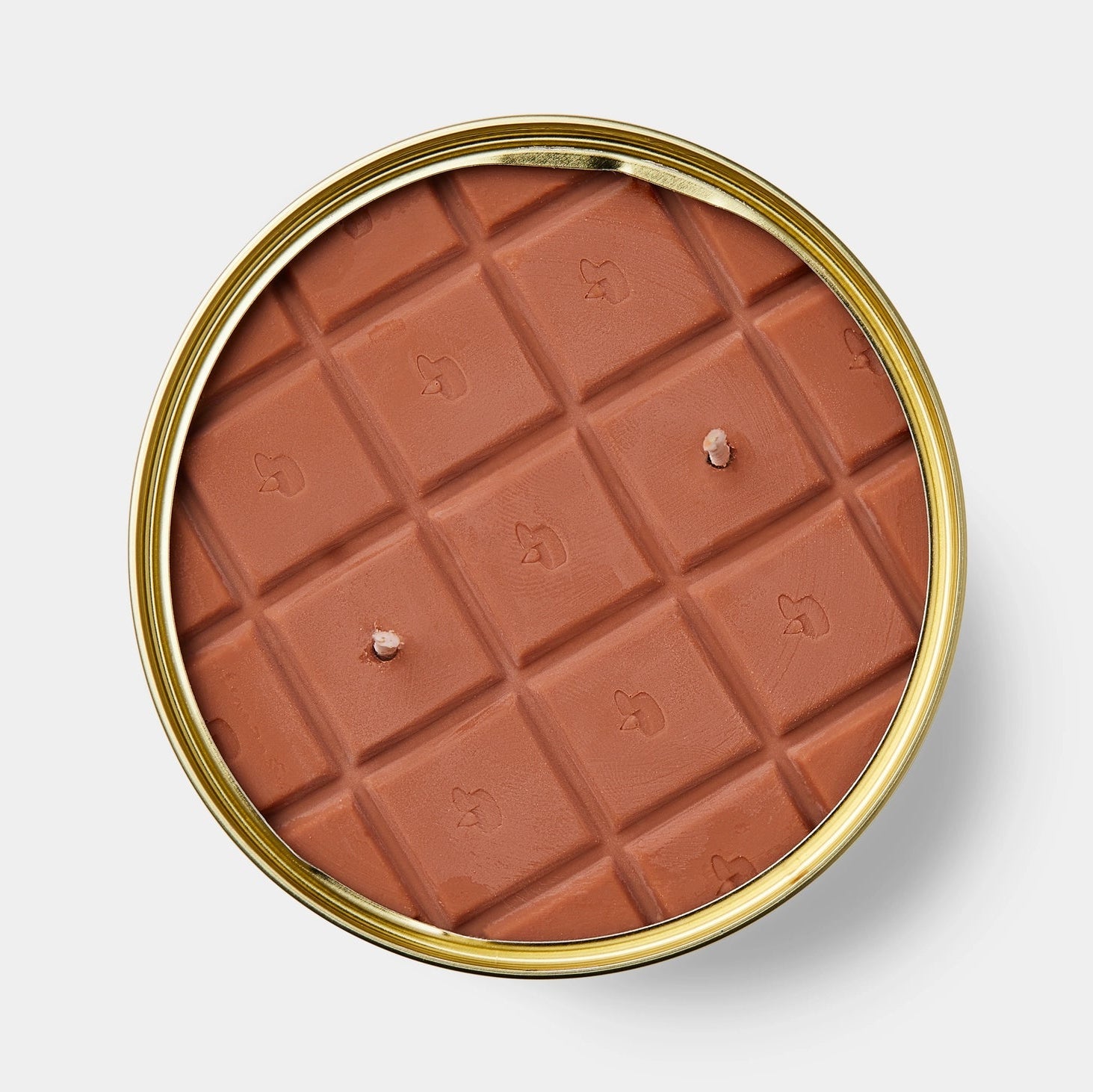 Top-down view of chocolate scented candle in tin, showing detailed chocolate bar design and triple wick placement.