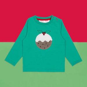 Green children’s long sleeve Christmas Pudding Top with pudding applique on red and green background.