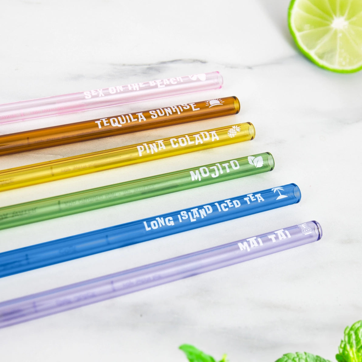 Flat lay of six cocktail recipe straws labelled with classic drinks: Sex on the Beach, Mai Tai, Mojito, Pina Colada, Tequila Sunrise, and Long Island Iced Tea.