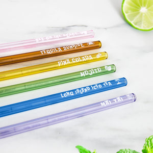 Flat lay of six cocktail recipe straws labelled with classic drinks: Sex on the Beach, Mai Tai, Mojito, Pina Colada, Tequila Sunrise, and Long Island Iced Tea.