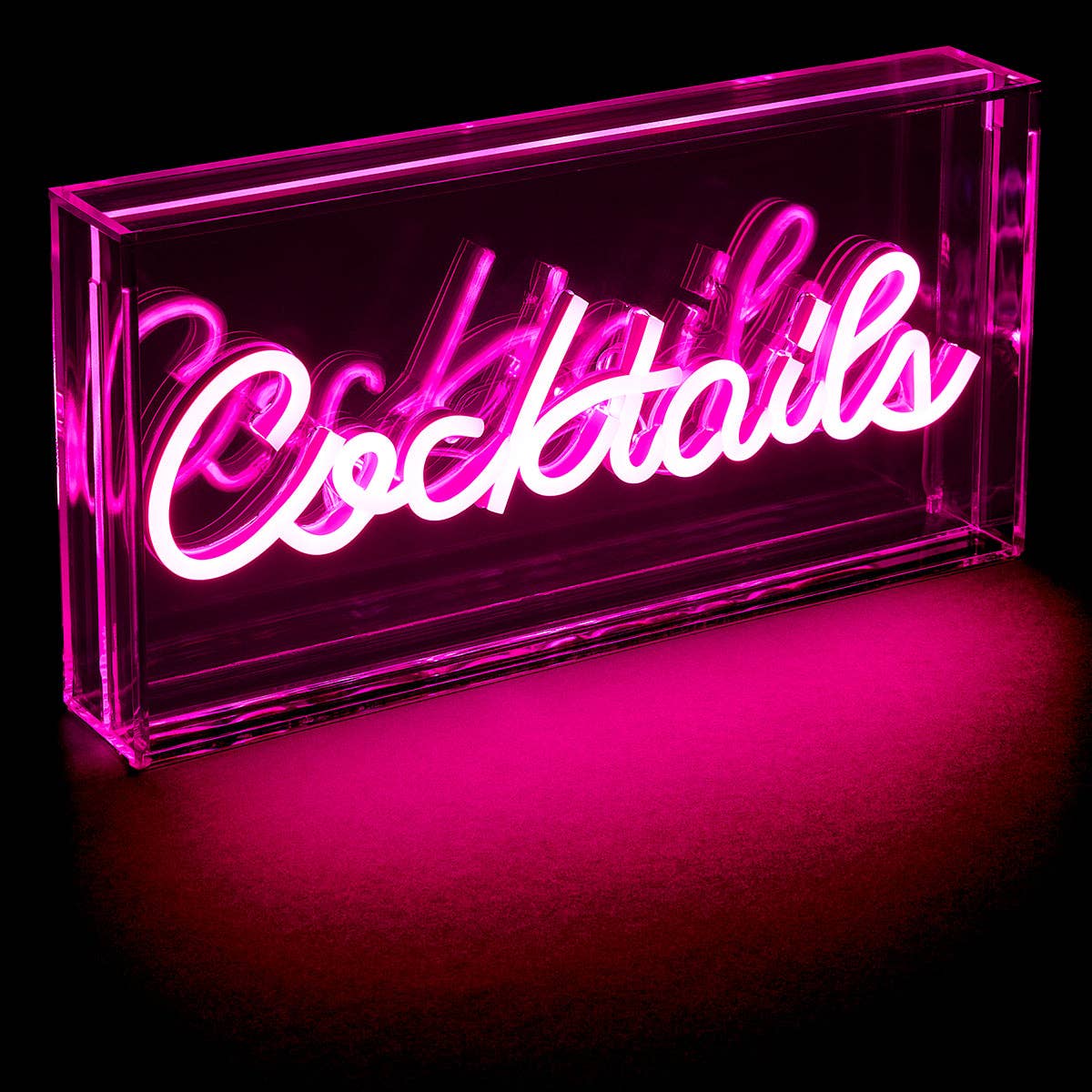 Cocktails Neon LED Lightbox glowing bright pink in a dark room.