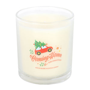 Close-up of Coming Home For Christmas candle showing red car and spiced berry label.