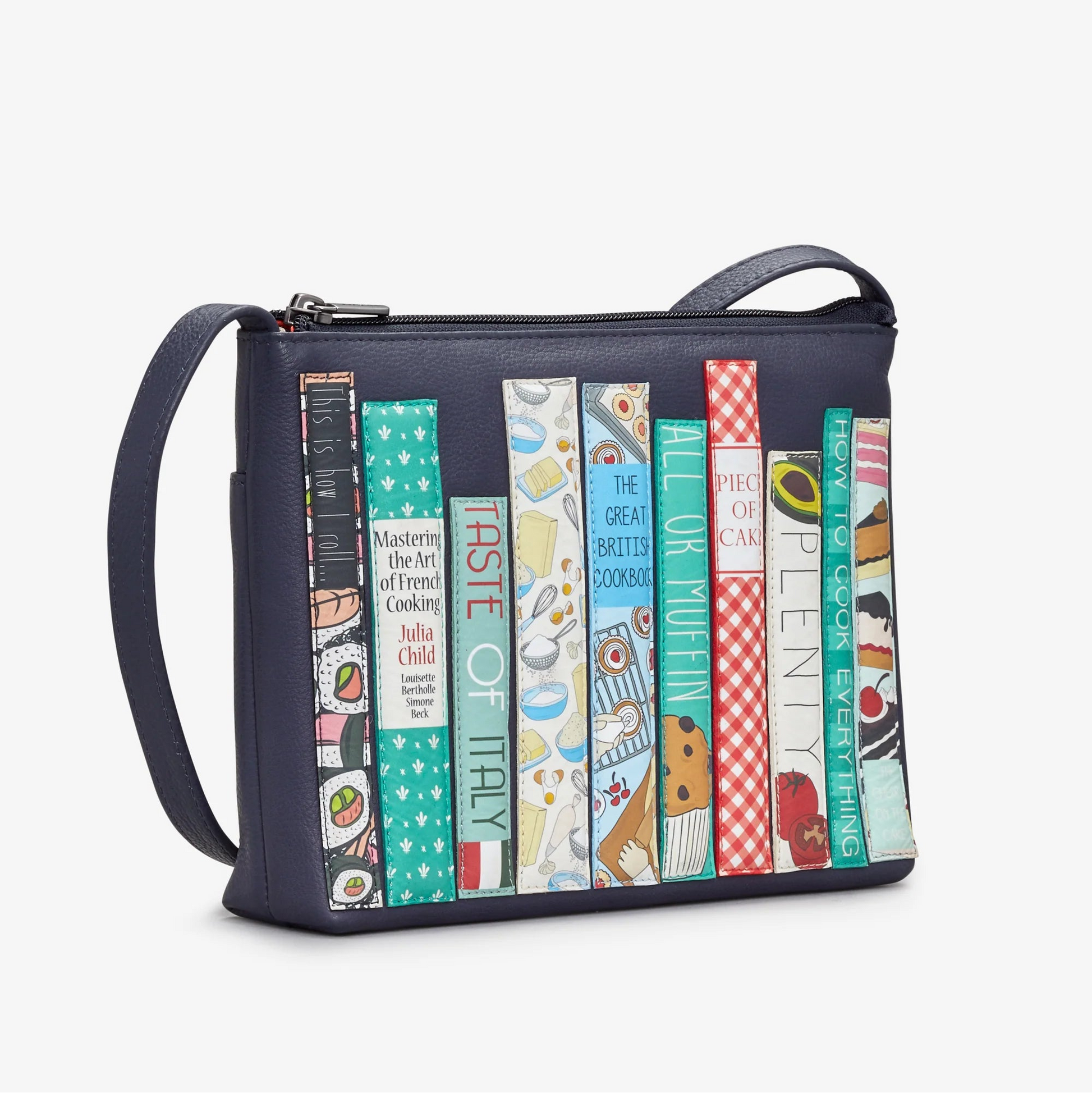 Side view of Cook Bookworm Parker Cross Body Bag showing detailed cookbook spine appliqués.