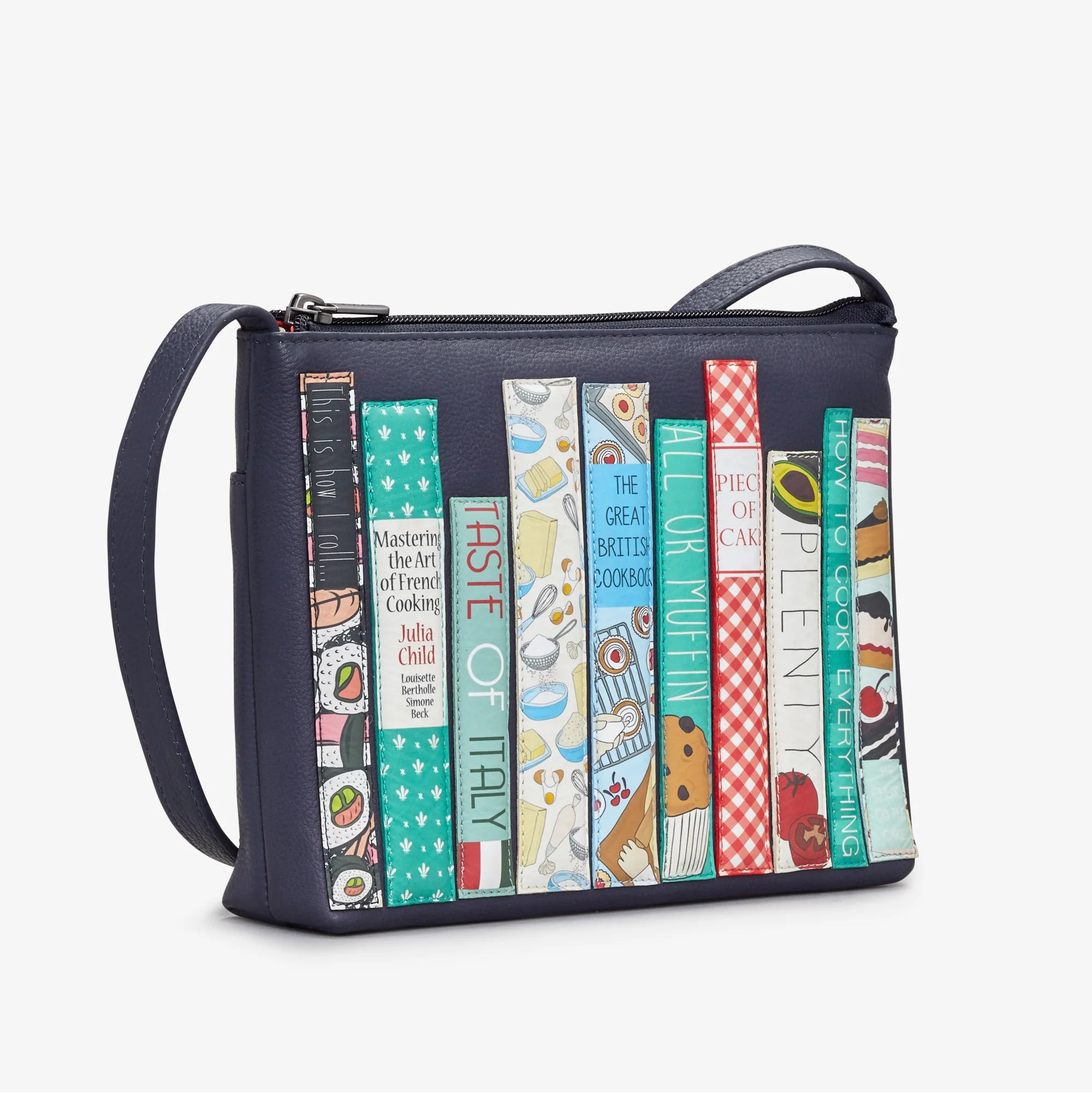 Side view of Cook Bookworm Parker Cross Body Bag showing detailed cookbook spine appliqués.