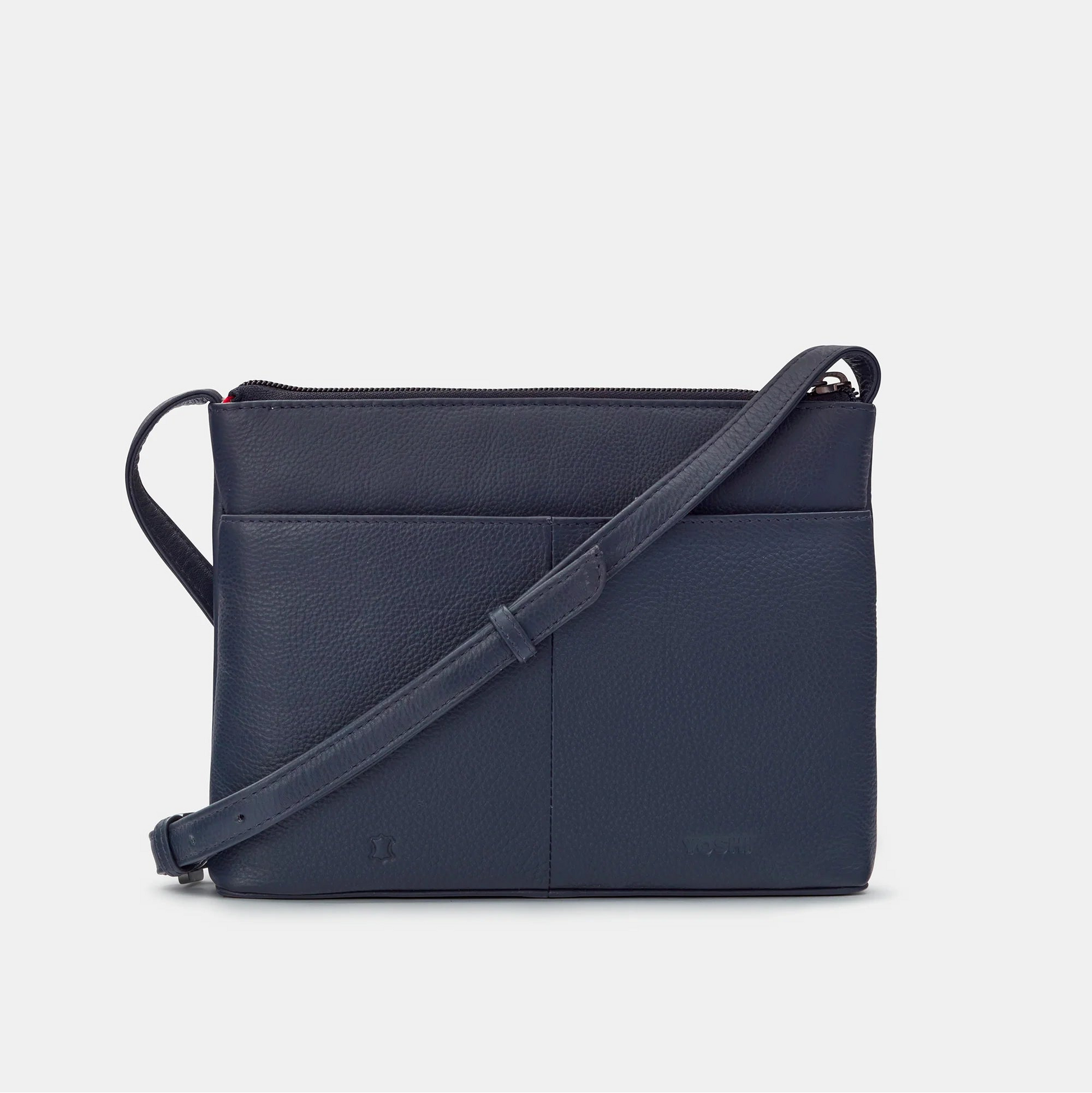 Back view of navy leather Cook Bookworm Parker Cross Body Bag with zip top and pocket.