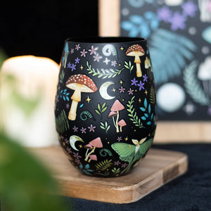 Dark Forest Print Stemless Wine Glass with celestial night forest design featuring toadstools, luna moths, and stars.