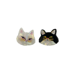 A pair of cat-shaped hair clips isolated on a white background, showing off their acrylic material and detailed design.