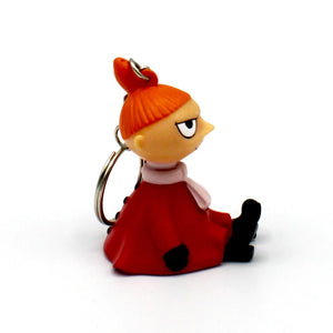 Side view of the Moomin “Little My” keyring, displaying its red dress, scarf, and expression.