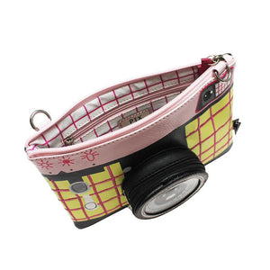 Top view of the makeup bag, showing the spacious zippered compartment with checkered lining.