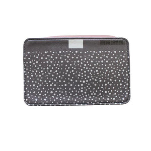 Back of the bag with a black and white polka dot pattern, adding a contrasting playful touch.