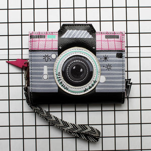 Front view of Disaster Designs Pix Camera Wallet, showcasing its vintage camera design with a black, grey, and pink colour scheme.